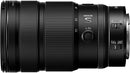 Close-up of Nikon NIKKOR Z 24-70mm f/2.8 S II lens mounted on a camera setup with SmallRig video cage