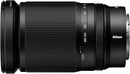 Direct side profile view of the compact Nikon NIKKOR Z 28-400mm f/4-8 VR all-in-one superzoom lens highlighting the zoom lock button and rear lens mount