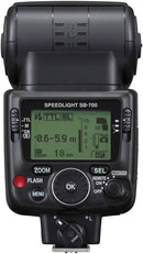 Direct rear view of the Nikon SB-700 Speedlight featuring the green LCD control screen, rotary dial, and wireless master-remote switch