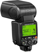Angled rear view of the Nikon SB-5000 Speedlight showing the illuminated green LCD display, control wheel, and tilt indicators